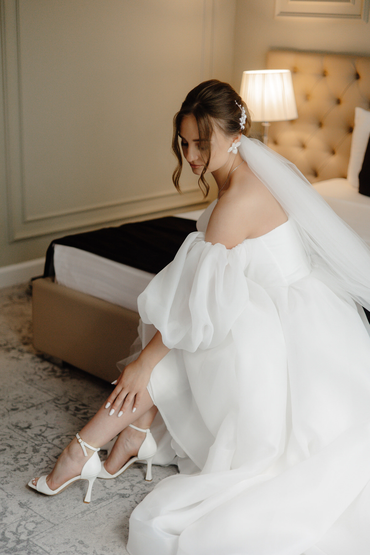 bride-white-dress-sits-carpet bride-white-dress-sits-carpet